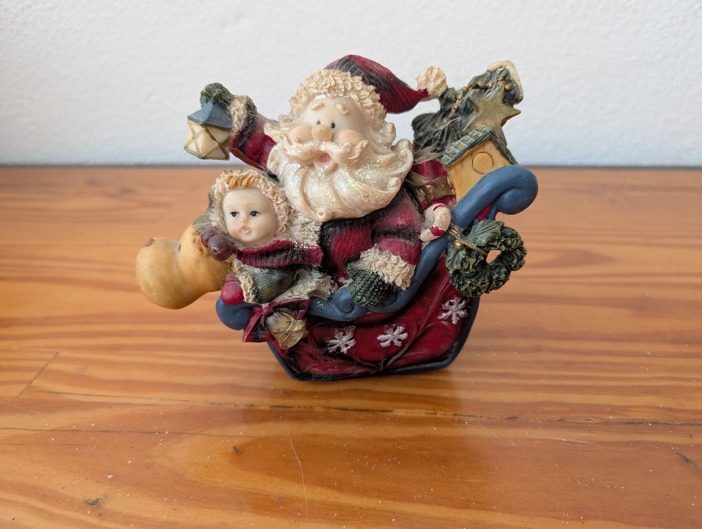 Santa and Child in Sleigh Figurine from Unknown - Holiday Decor (Resin Figurine / Ornament, Whimsical, Folk Art, Red, Brown, Blue)